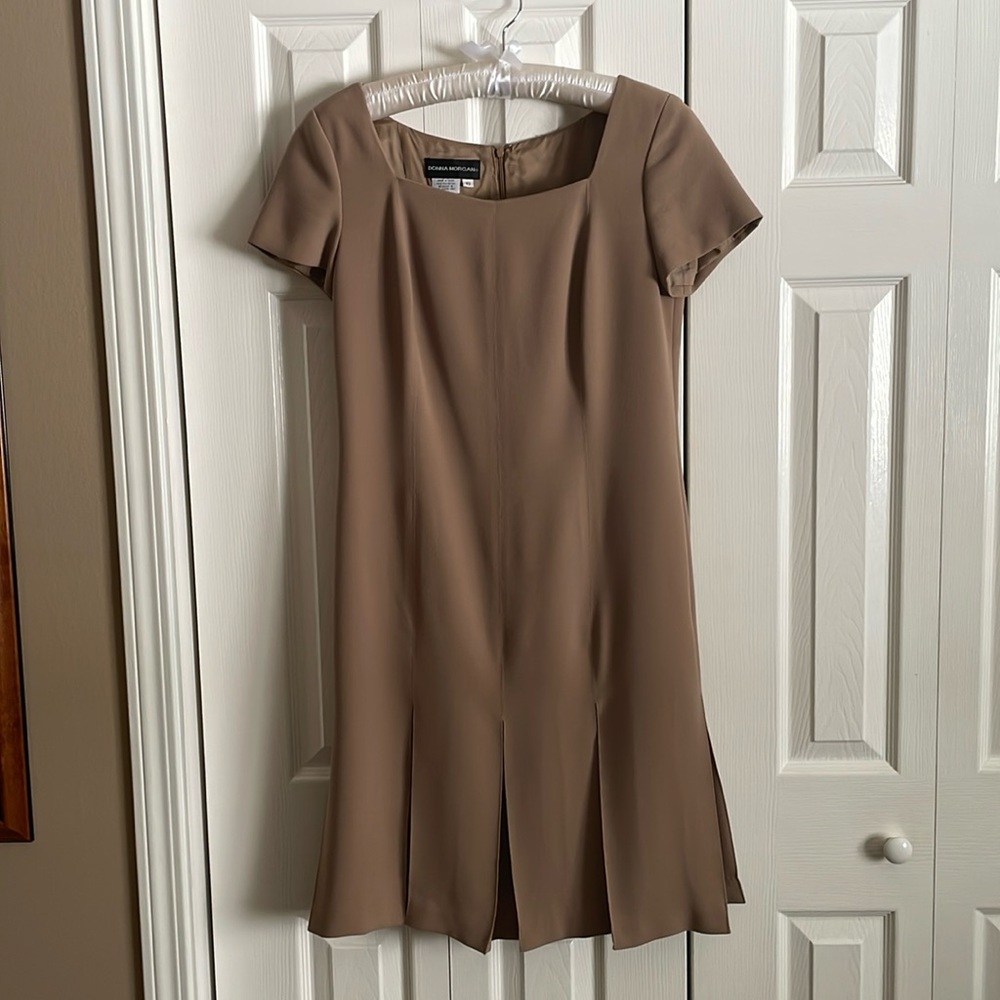 Square neck, fully lined, box pleated front and back.